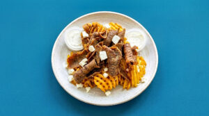1/2 POUND LOADED LAMB GYRO FETA FRIES w/ 2 SIDES OF TZATZIKI